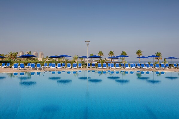 Indoor pool, seasonal outdoor pool, pool umbrellas, sun loungers