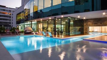 Indoor pool, outdoor pool, open 7:00 AM to 6:00 PM, pool loungers