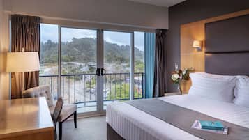 Deluxe Room, 1 King Bed, Balcony | In-room safe, desk, iron/ironing board, free cribs/infant beds