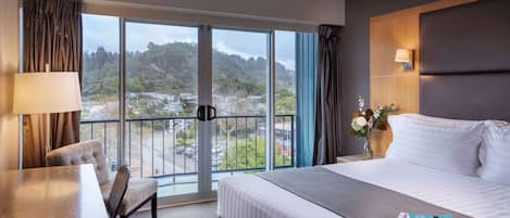 Deluxe Room, 1 King Bed, Balcony | In-room safe, desk, iron/ironing board, free cribs/infant beds