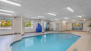 Indoor pool, open 9:00 AM to 10:00 PM, pool loungers