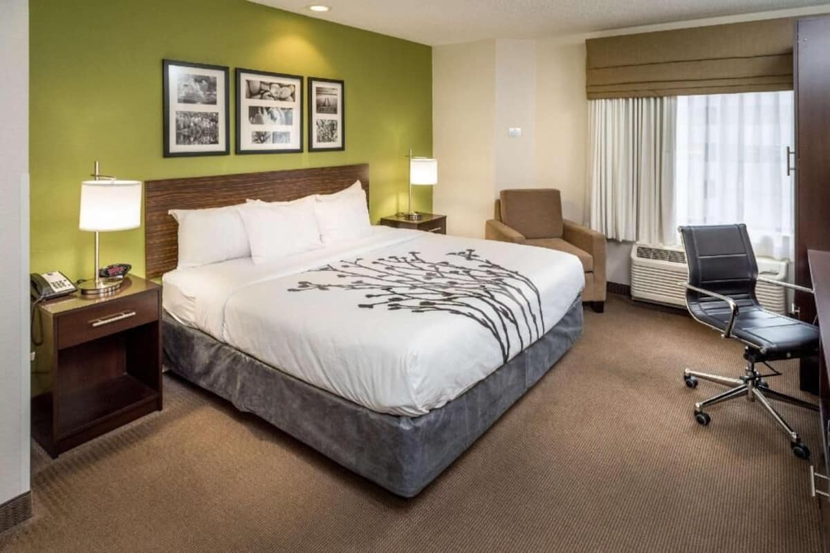 Premium bedding, blackout drapes, iron/ironing board