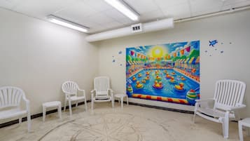 Indoor pool, open 9:00 AM to 10:00 PM, pool loungers
