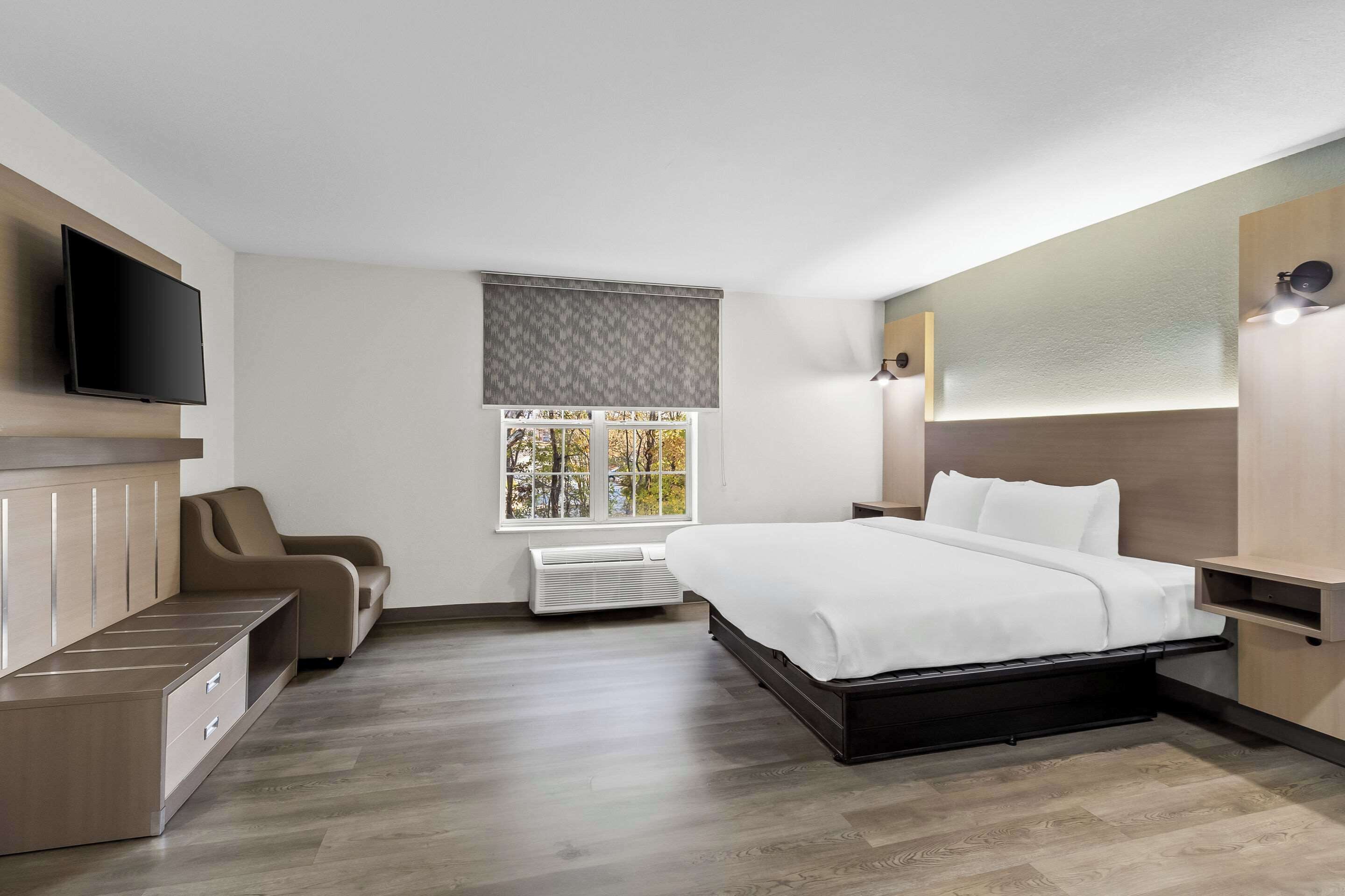 Premium bedding, desk, laptop workspace, free WiFi