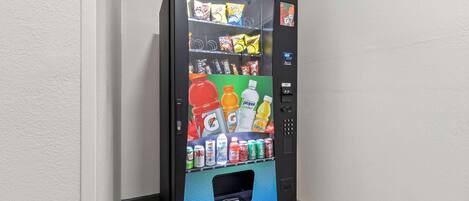 A vending machine with various snacks and drinks.