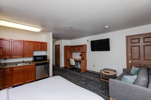 Premium bedding, desk, laptop workspace, iron/ironing board