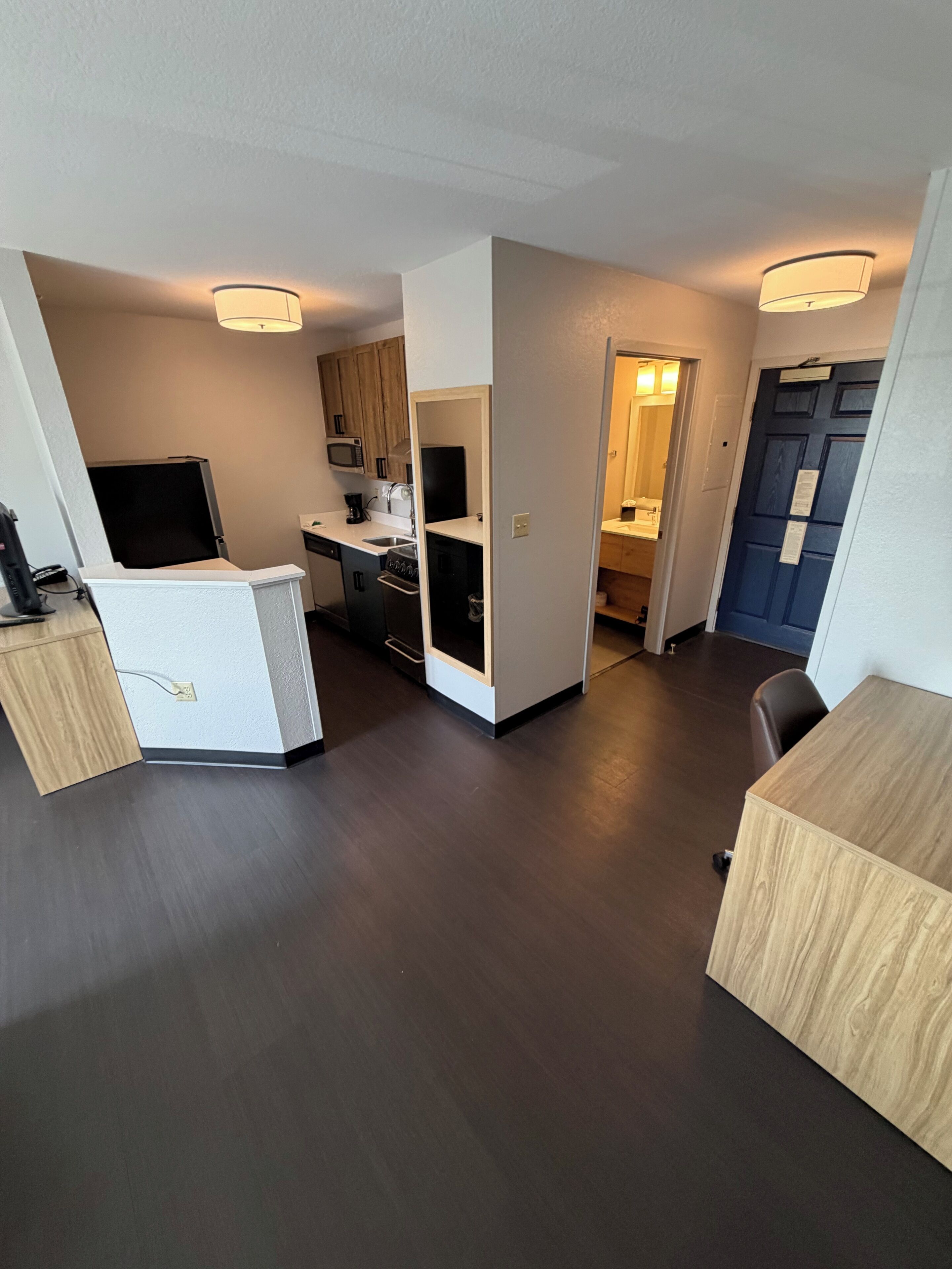 Desk, laptop workspace, blackout curtains, iron/ironing board
