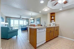 Apartment, 2 Bedrooms, Oceanfront | Living area | 32-inch flat-screen TV with cable channels