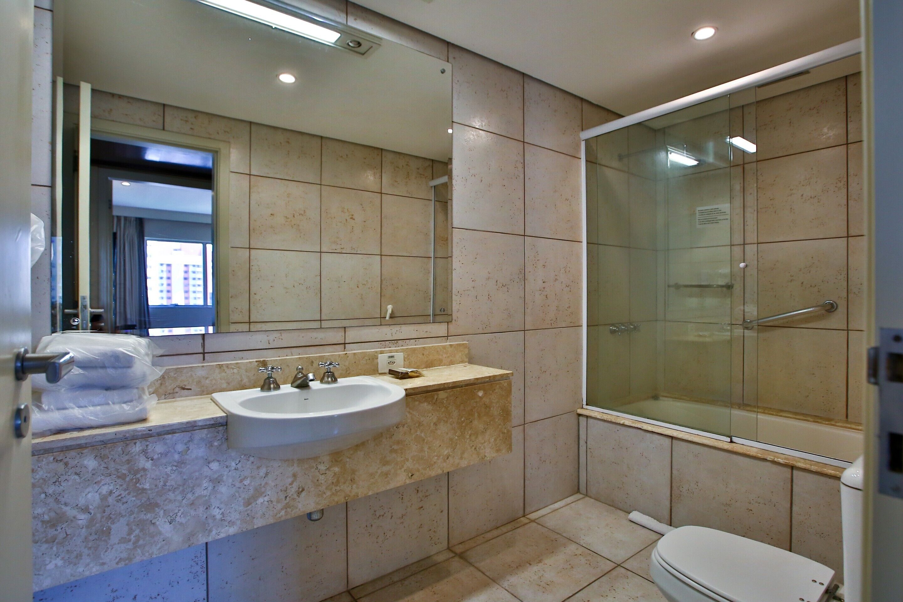 combined shower/bathtub, deep-soaking bathtub, rainfall showerhead