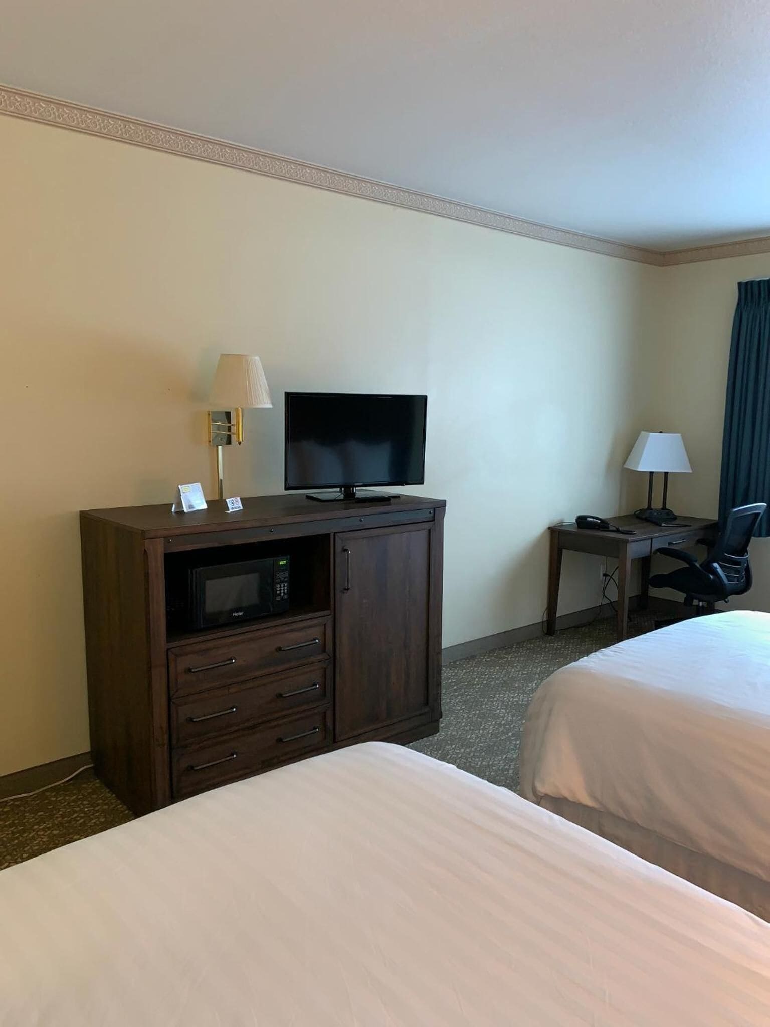 desk, laptop workspace, blackout curtains, iron/ironing board