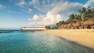 On the beach, white sand, 2 beach bars