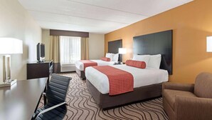 A hotel room with two beds, a desk with a chair, a TV, and a large window with curtains. - Comfort Inn & Suites Tampa North I-75 (Tampa)