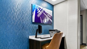 A modern office space with a desk, chair, computer, and printer. - Comfort Inn & Suites Grand Blanc/Flint (Grand Blanc)