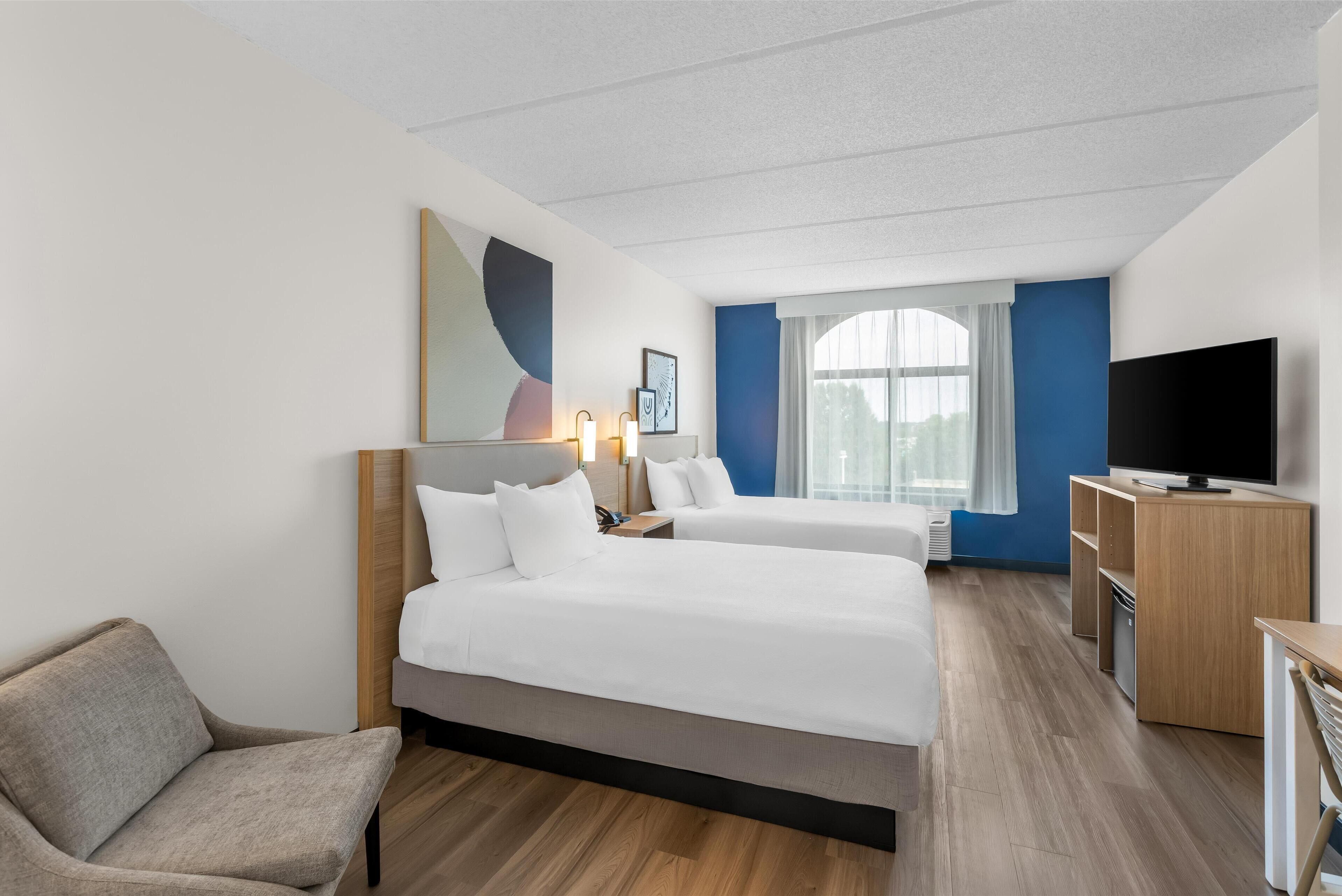 room, 2 queen beds | in-room safe, desk, laptop workspace, blackout curtains