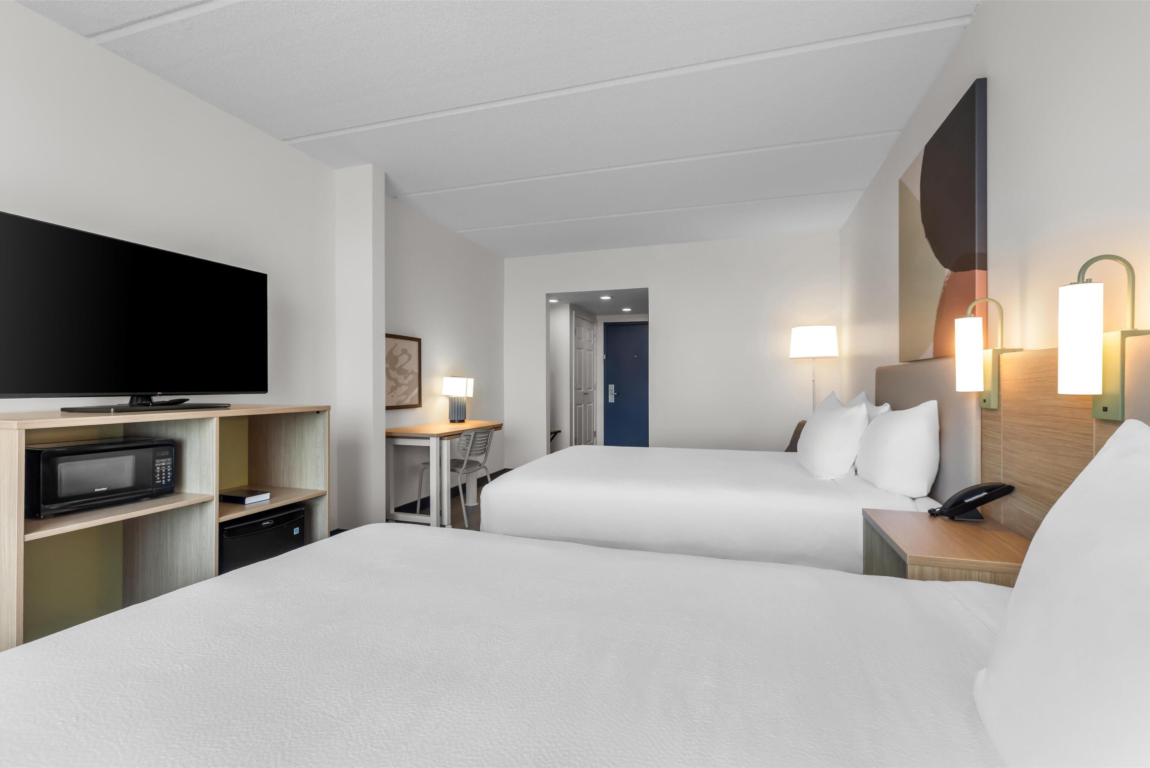 room, 2 queen beds | in-room safe, desk, laptop workspace, blackout curtains