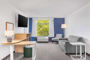 Suite, 1 Bedroom | Living area | 55-inch flat-screen TV with cable channels, TV, streaming services