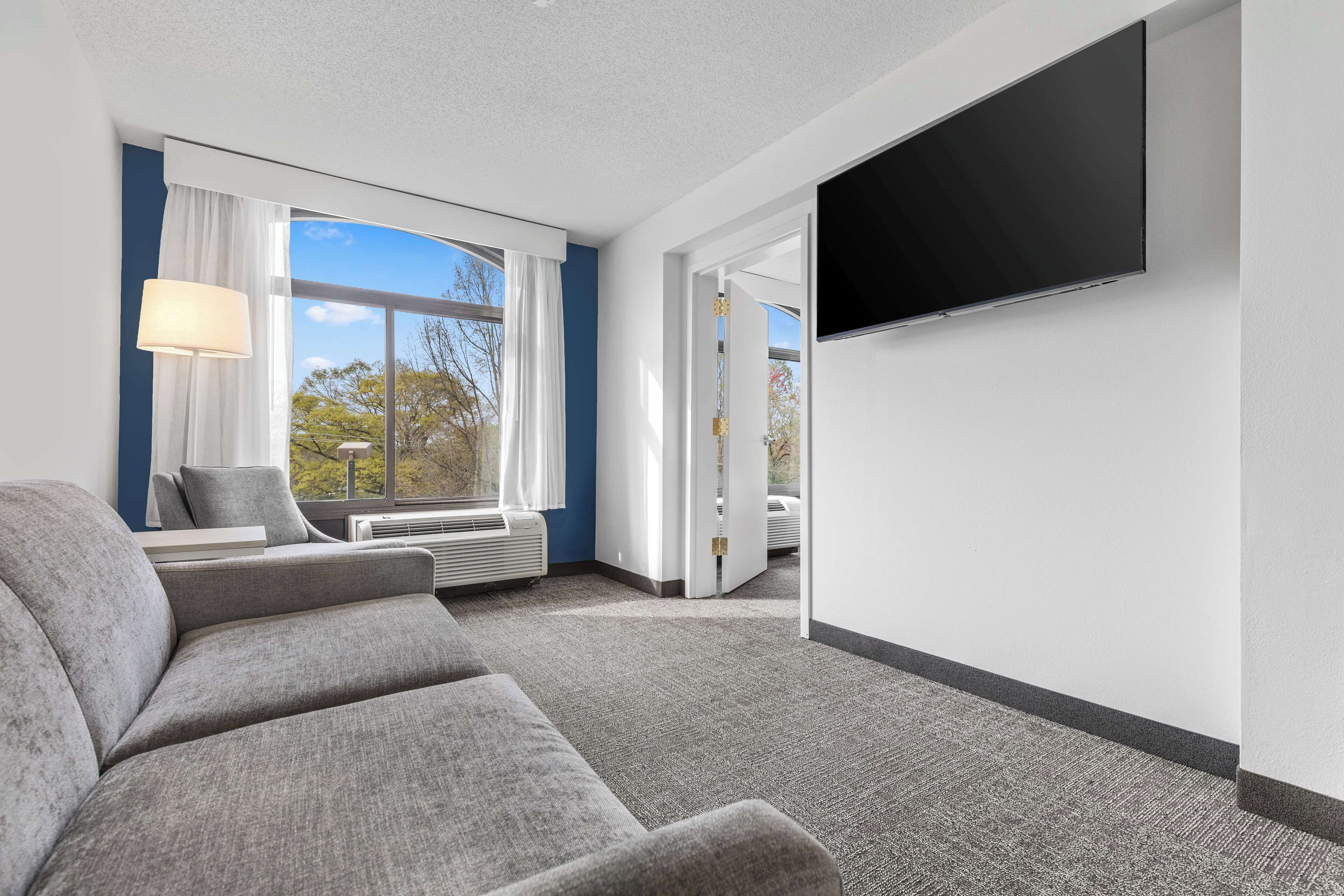 Suite, 1 Bedroom | Living area | 55-inch flat-screen TV with cable channels, TV, streaming services