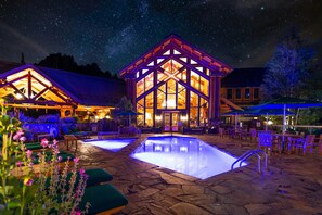 A lodge with a large central building, outdoor pool, and patio seating. - Mountain Lodge Telluride (Telluride)