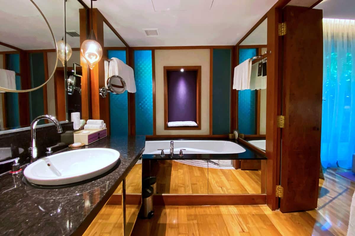 separate bathtub and shower, rainfall showerhead, designer toiletries