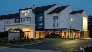 A multi-story hotel with a sign reading "Springhill Suites by Marriott."