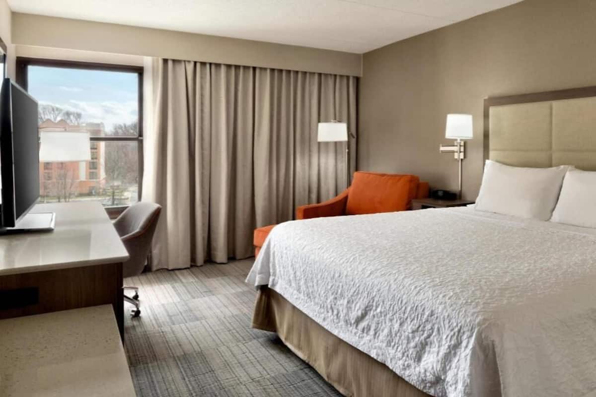 Premium bedding, desk, laptop workspace, iron/ironing board