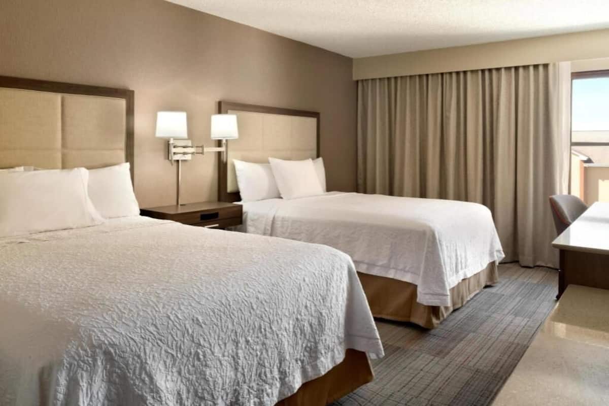 Premium bedding, desk, laptop workspace, iron/ironing board