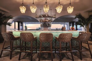 2 bars/lounges, poolside bar, beach bar