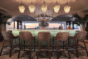 2 bars/lounges, poolside bar, beach bar
