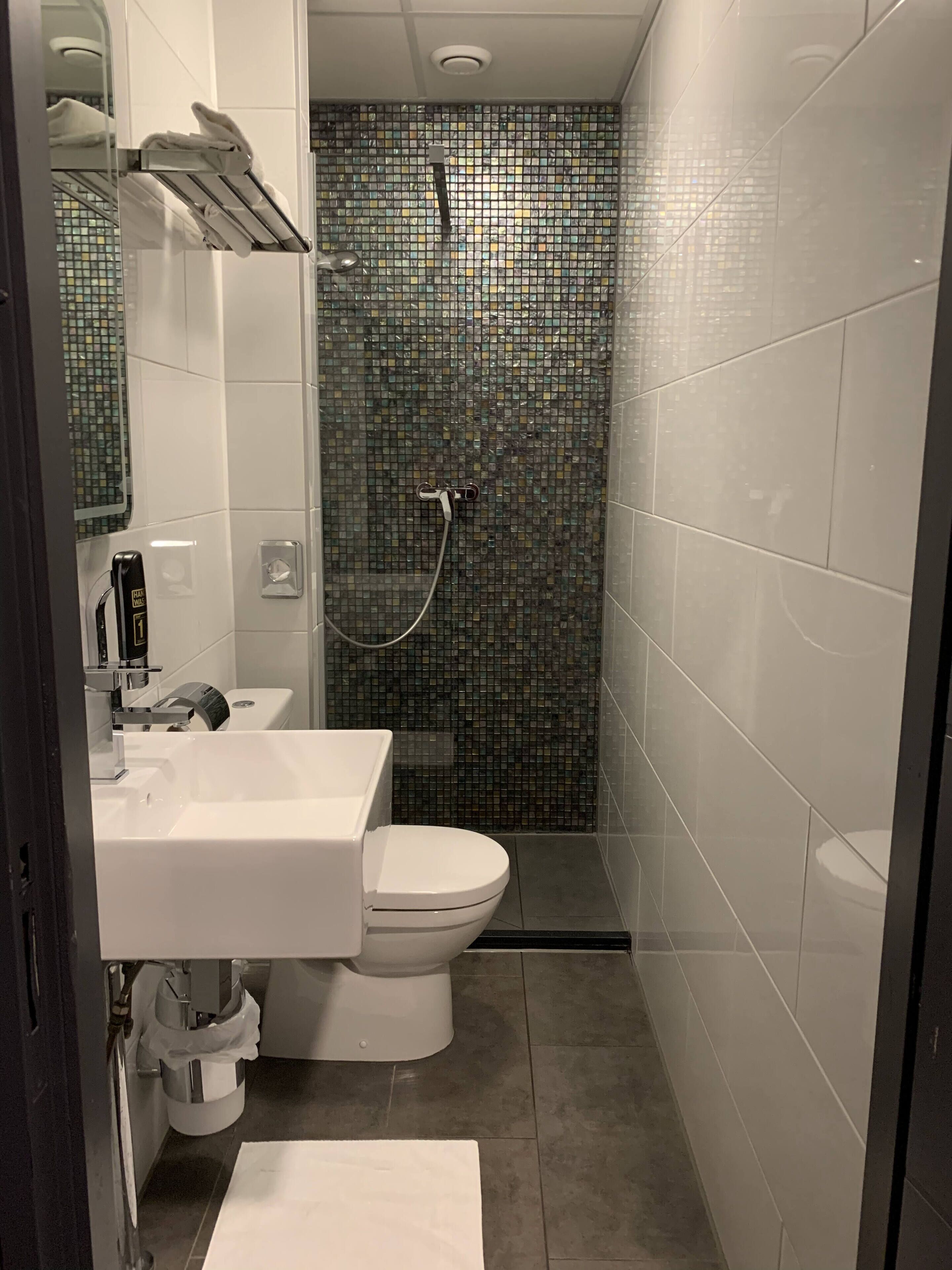 double room (small) | bathroom | shower, hair dryer, towels, soap