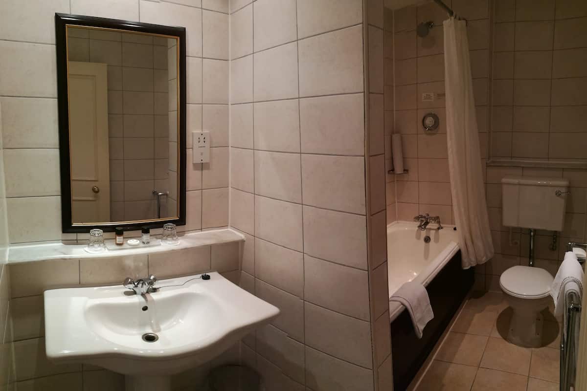 standard twin room | bathroom | designer toiletries, hair dryer, towels