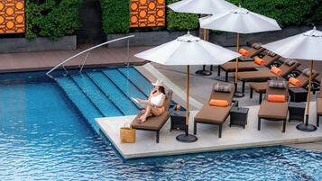 Outdoor pool, open 7:00 AM to 9:00 PM, pool umbrellas