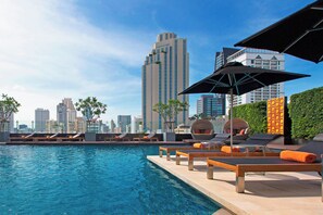 Outdoor pool, open 7:00 AM to 9:00 PM, pool umbrellas