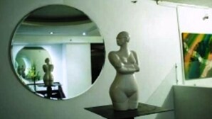 A minimalist art gallery with a sculpture on display. - Caracas Cumberland  (Caracas)