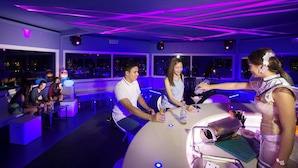 A modern bar/lounge area with neon lighting, seating arrangements, and a bar counter with a grill. - Plantation Bay a Real Resort with a Real Spa (Lapu-Lapu)