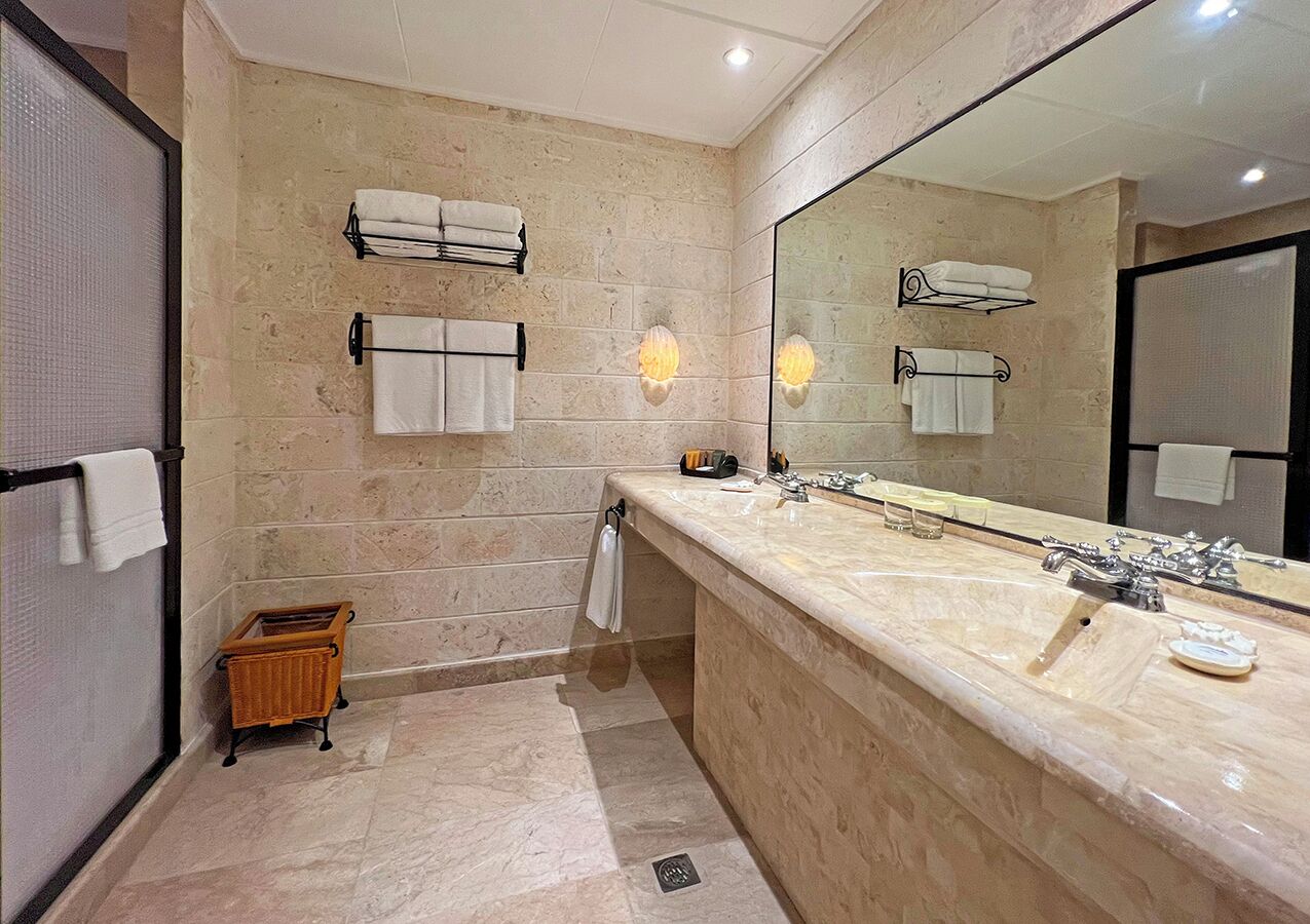 upper-floor friends-and-family room | bathroom | free toiletries, hair dryer, slippers, bidet