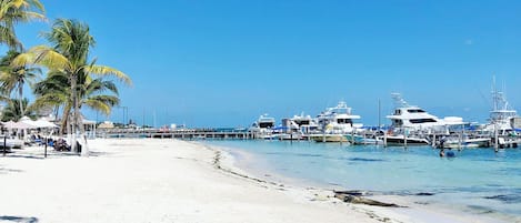 Private beach, white sand, sun loungers, beach umbrellas