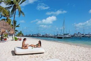 Private beach, white sand, sun-loungers, beach umbrellas
