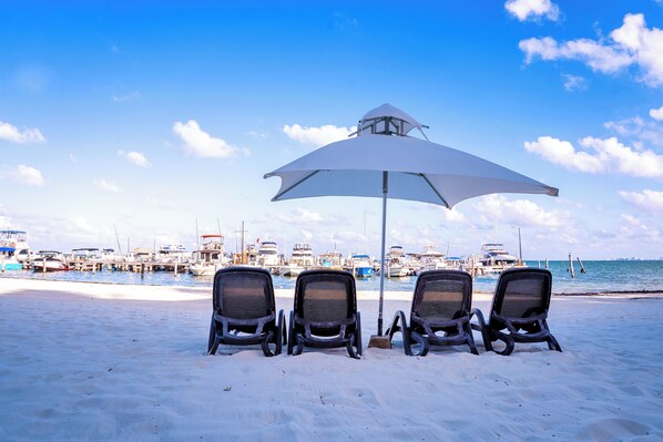Private beach, white sand, sun-loungers, beach umbrellas