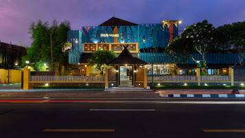 A building with a modern design, featuring a prominent entrance and a sign that reads "JOGJA VILLAGE".