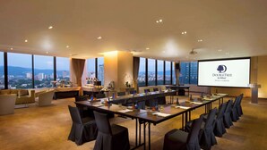 A conference room with a large screen displaying "DOUBLETREE by Hilton Kuala Lumpur". - DoubleTree by Hilton Hotel Kuala Lumpur (Kuala Lumpur)