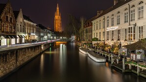A canal-side hotel with a sign reading "Hotel de Bruges." - Hotel de Orangerie by CW Hotel Collection - Small Luxury Hotels of the World (Bruges)