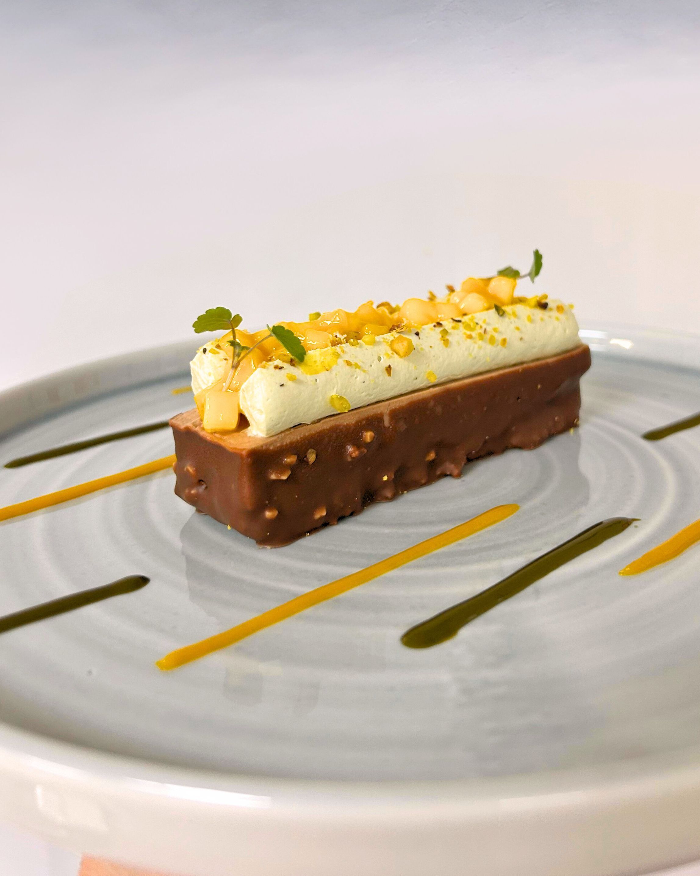 A dessert on a plate with a white background.