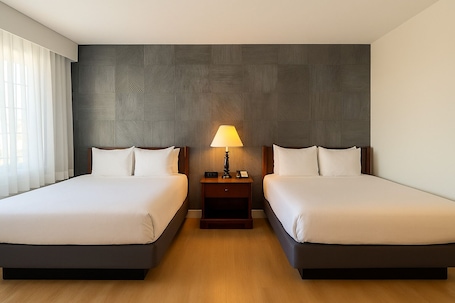 Deluxe Room, 2 Double Beds | Premium bedding, desk, laptop workspace, blackout drapes. Granada Inn