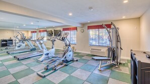 A gym with stationary bikes, treadmills, and weight machines. - Best Western Green Valley Inn (Green Valley)