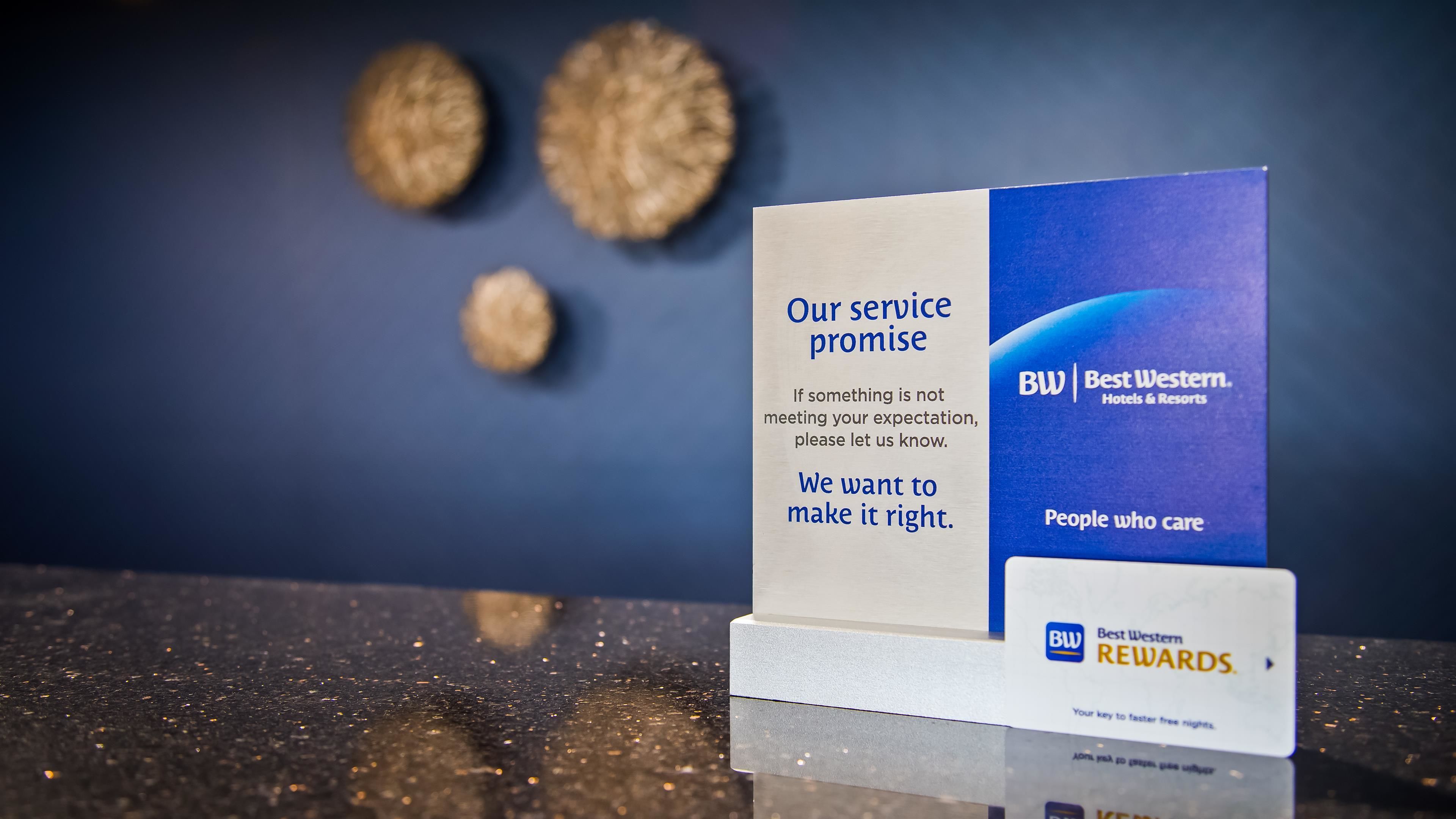 A service promise sign with a Best Western Rewards badge.
