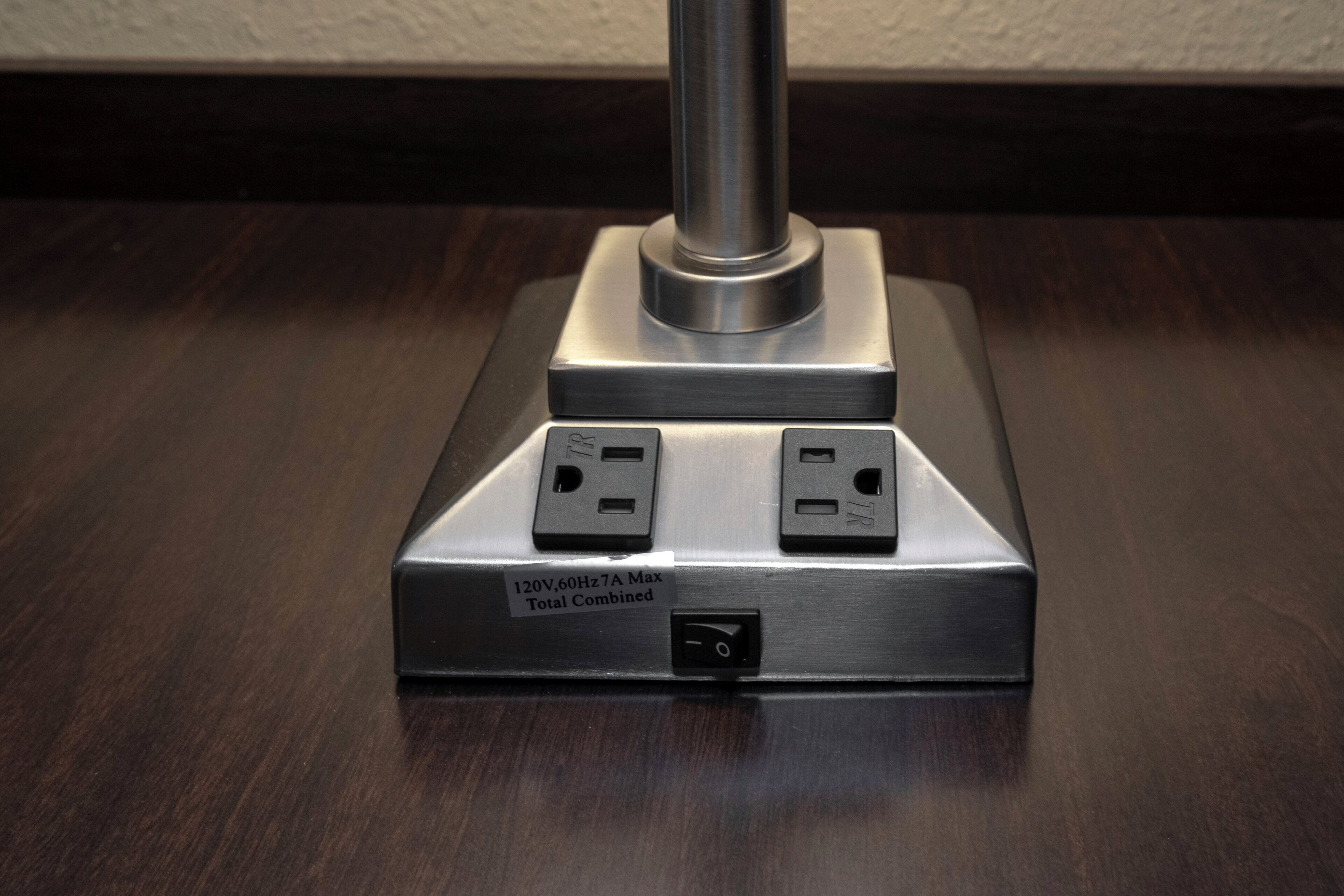 A power strip with two outlets and a switch, labeled '120V, 60Hz 7A Max Total Combined'.