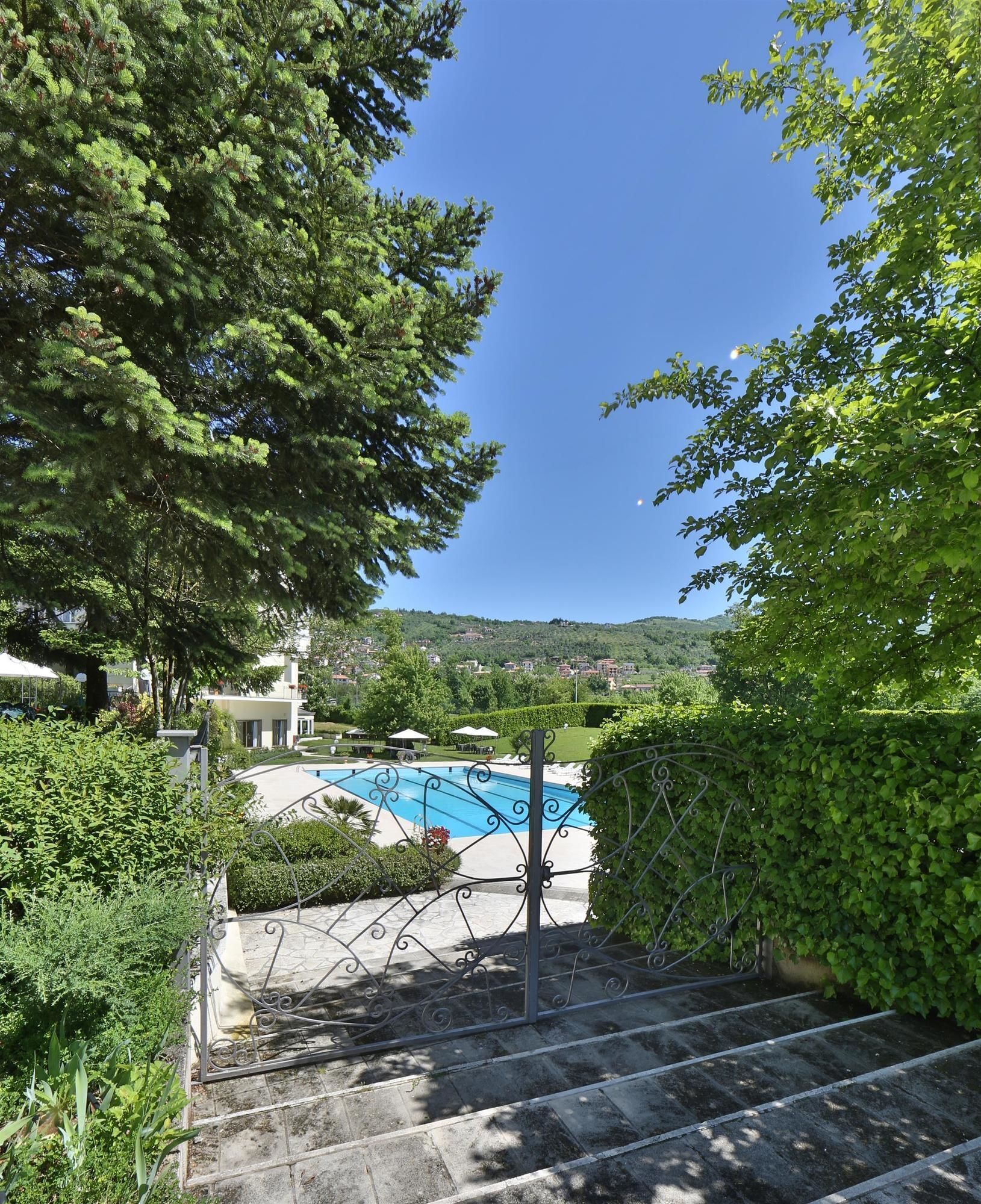 Indoor pool, outdoor pool, pool umbrellas, pool loungers