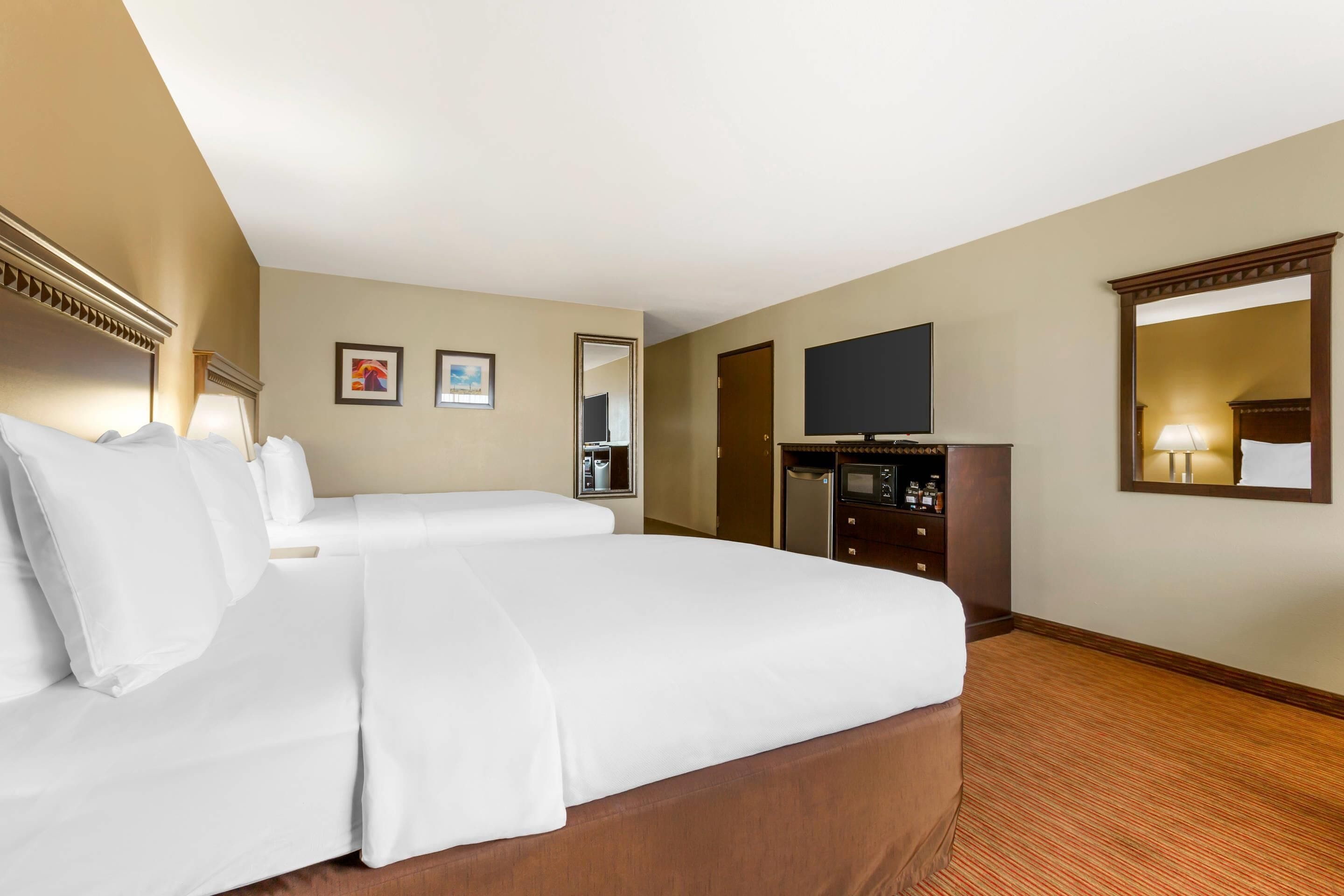 standard room, 2 queen beds, non smoking | premium bedding, desk, iron/ironing board, rollaway beds