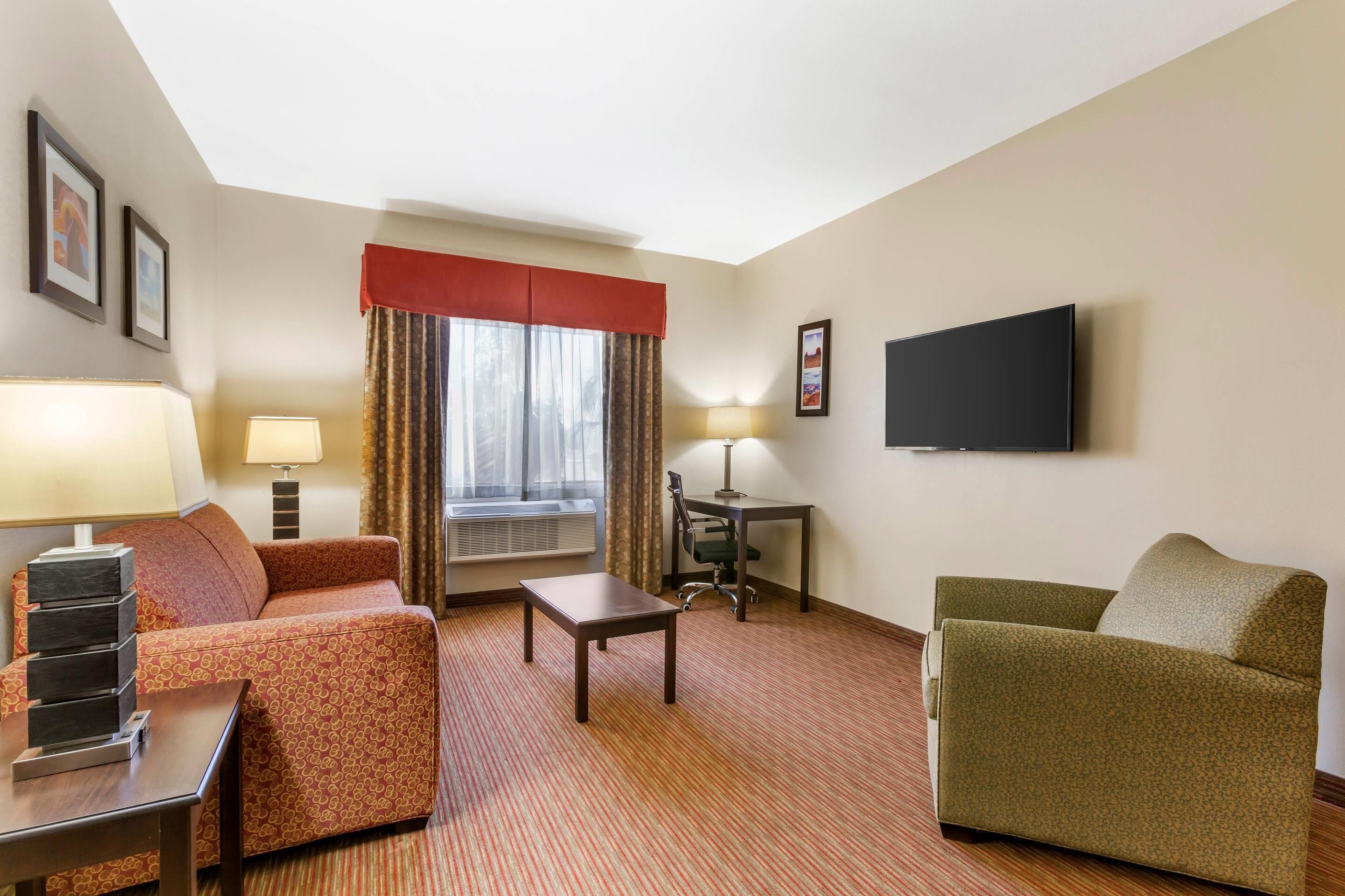 suite, 1 king bed, non smoking (sofa) | premium bedding, desk, iron/ironing board, rollaway beds