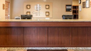 A reception desk with a sign reading "Comfort INN" and a digital check-in kiosk. - Comfort Inn Salida (Salida)